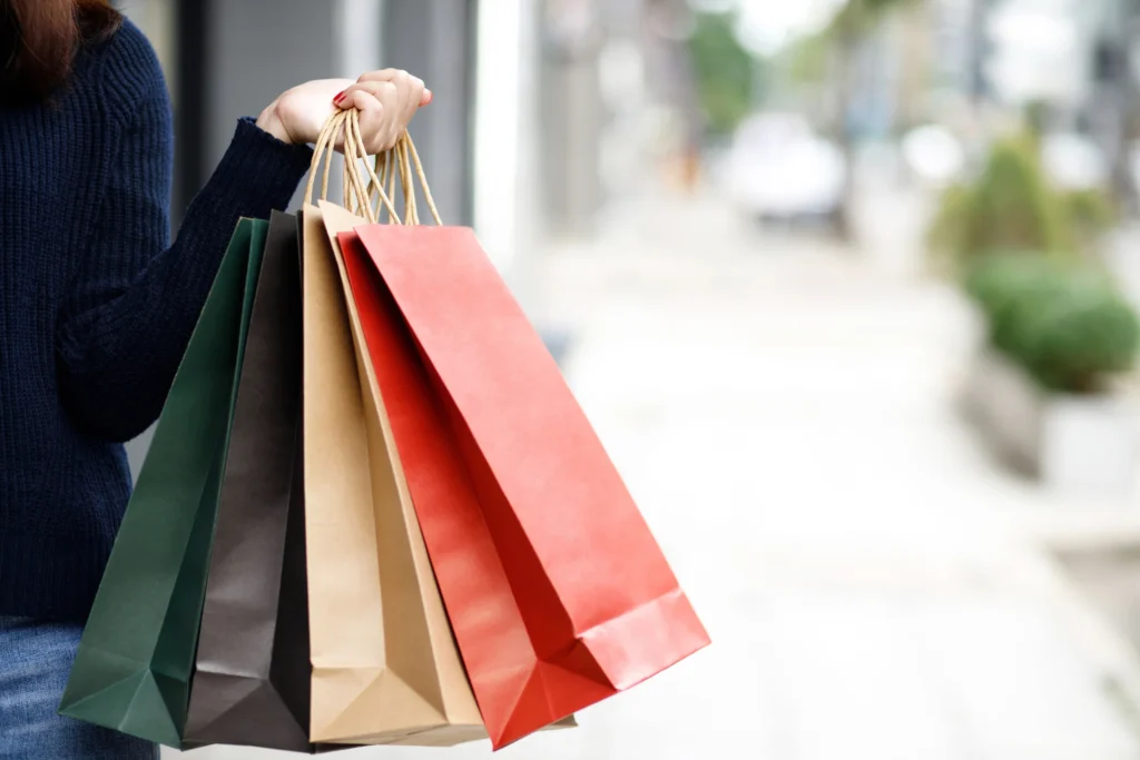 shopper carrying shopping bags