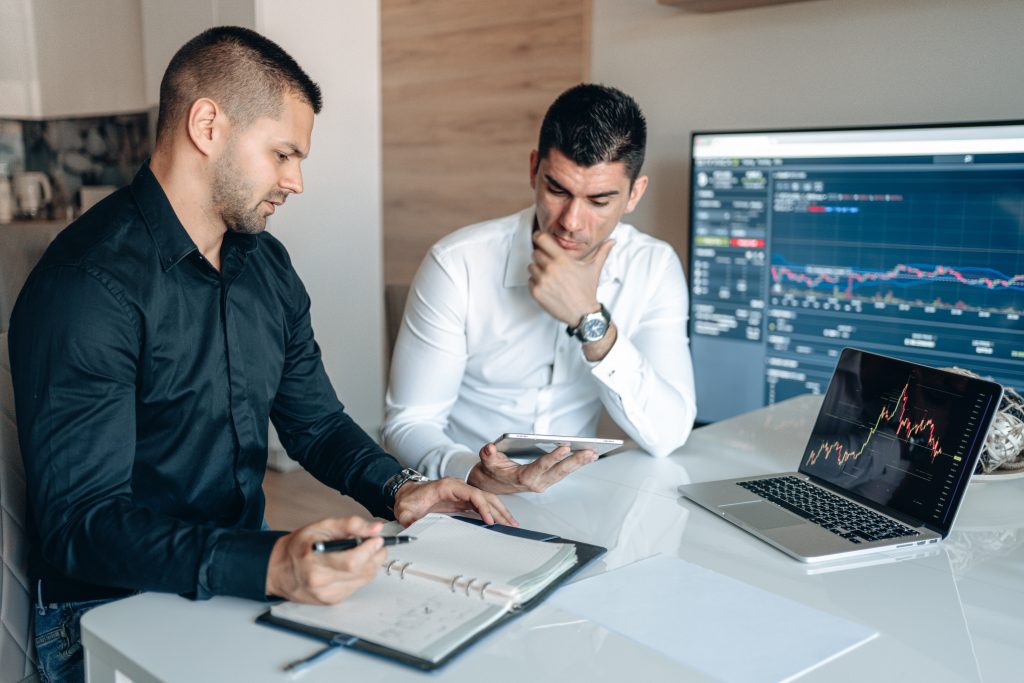 entrepreneurs reviewing marketing results