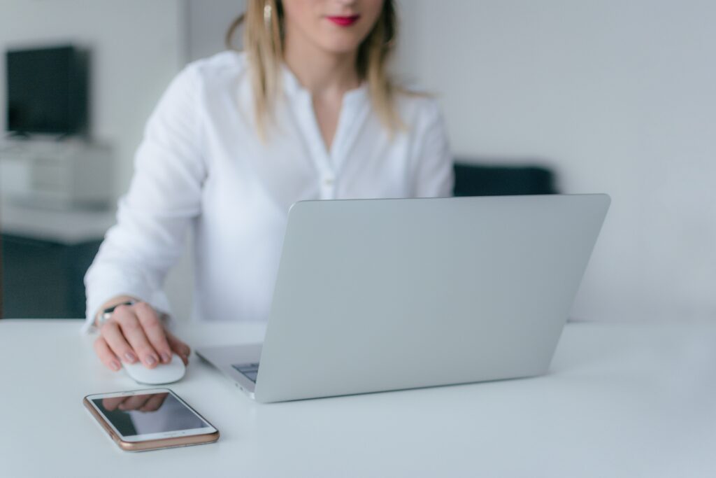 insurtech woman entrepreneur working on computer