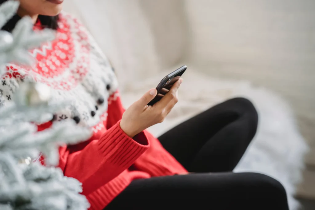 A girl looking at a notification on her phone