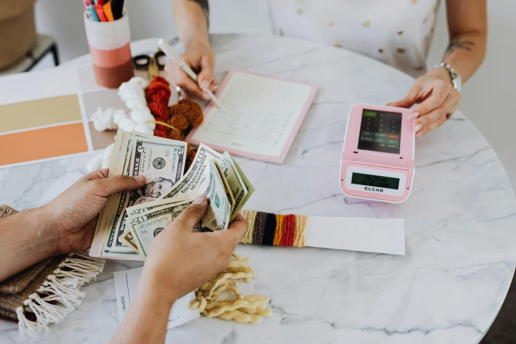 Two people counting money.