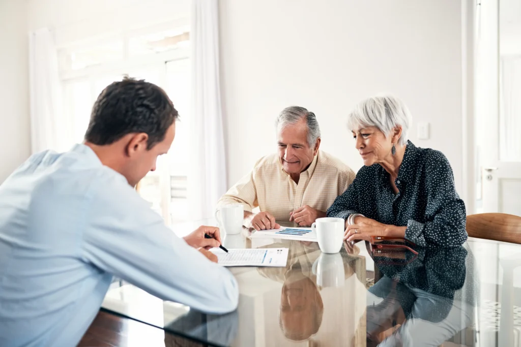retired couple with financial consultant about their personal pension plan