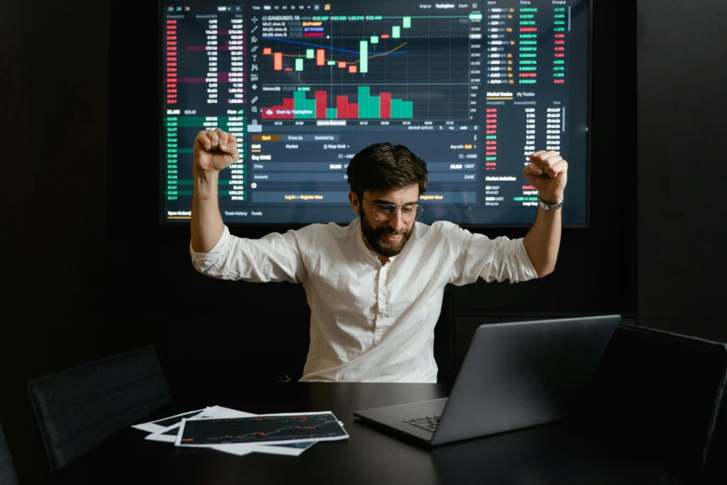 business man raising hands for forexbrokers trading